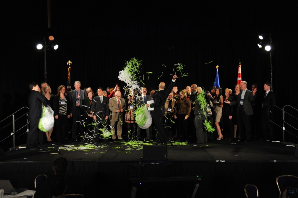 Farzad throwing confetti at annual meeting