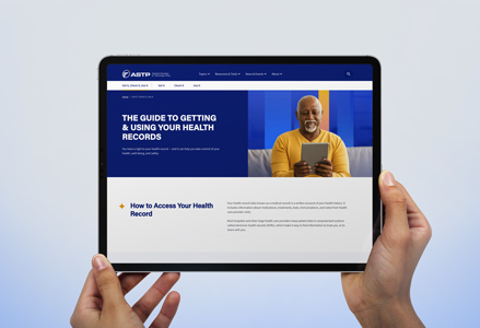 Hands holding a tablet visiting a website titled "The Guide to Getting & Using Your Health Records"